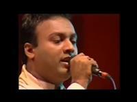 Portrait photo of the artist Ajith Premalal