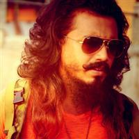 Portrait photo of the artist Arjuna Rookantha