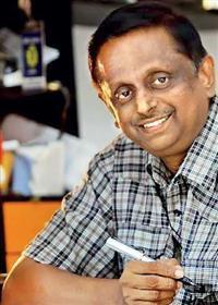 Portrait photo of the artist Bandula Nanayakkarawasam