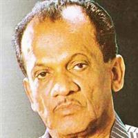 Portrait photo of the artist Claude De Zoysa