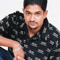 Portrait photo of the artist Iraj Weerarathne