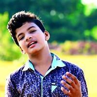 Portrait photo of the artist Sathyajith